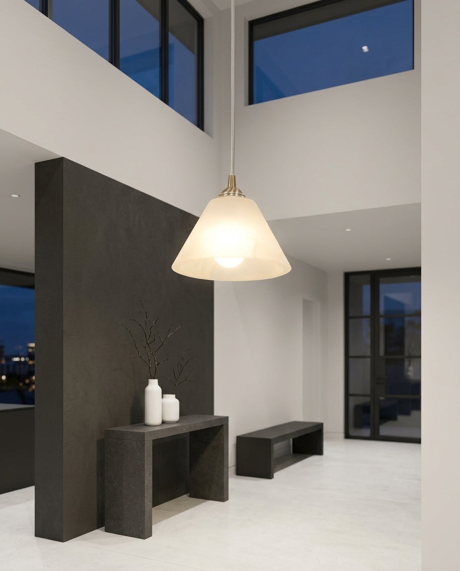 Small Alabaster Pendant Light hanging in a double-height entryway above a console table, evening