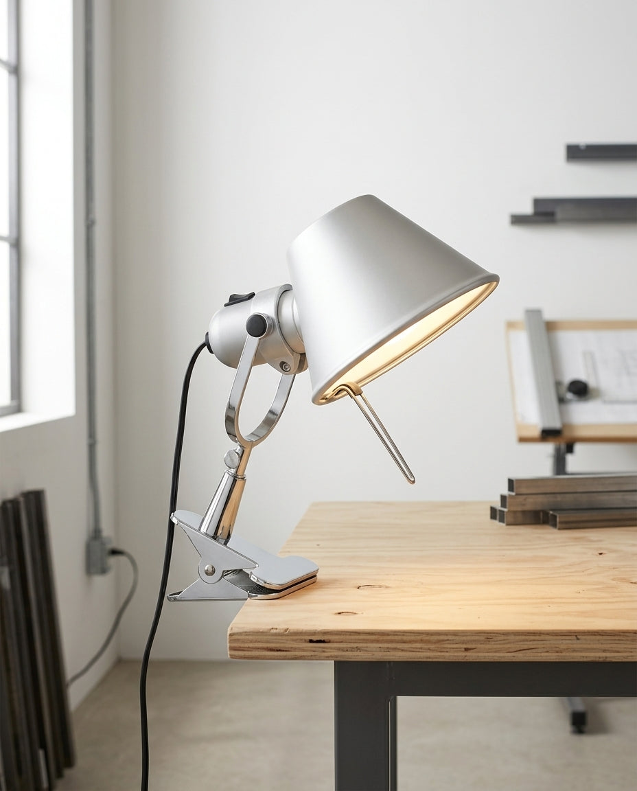 Clip-On Task Lamp on a wide work table in a bright modern studio, natural light from the left