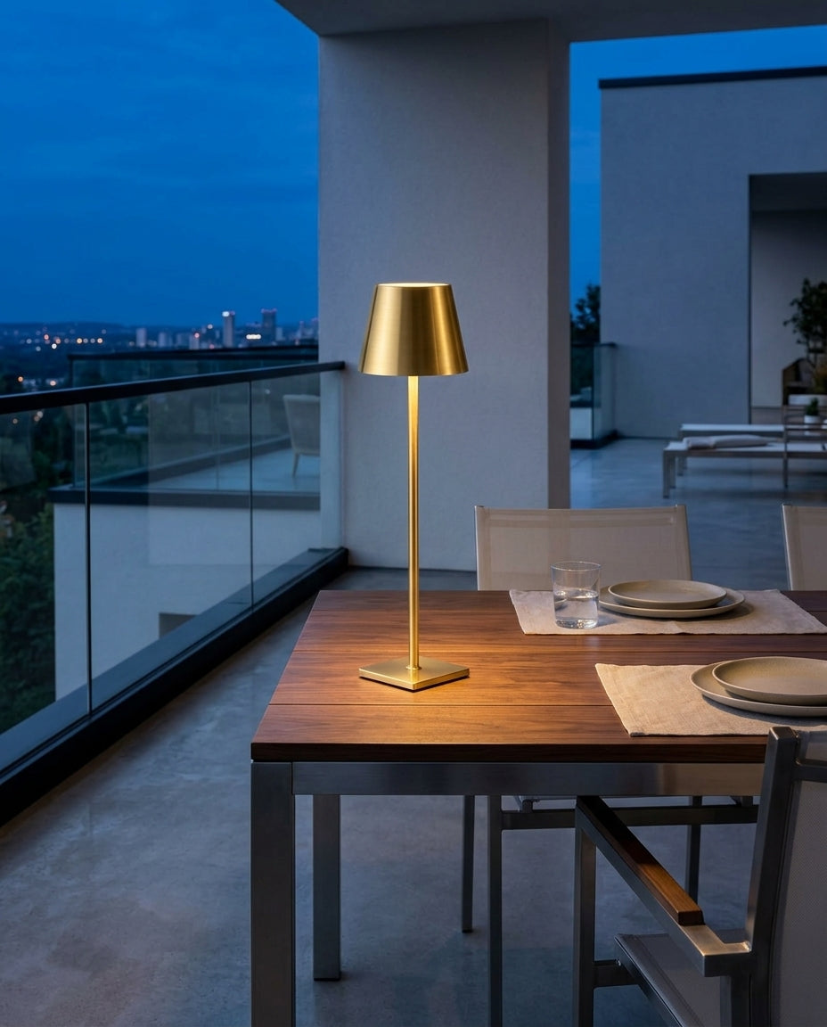 Cordless Aluminum Table Lamp, Set of Two on an outdoor dining table on a modern terrace at dusk, no cable anywhere in frame